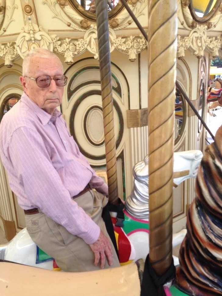 3. "My sister has somehow managed to get grandpa up on the carousel. He seems to be having fun."