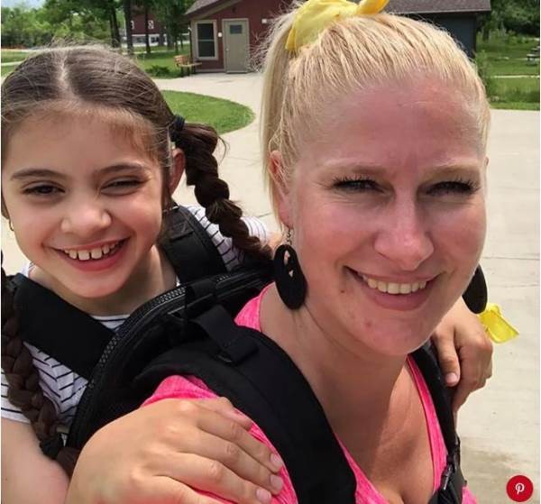 She bought a hiking backpack that could support the weight of the child and offered to carry her on her back while the class was trekking in the woods.