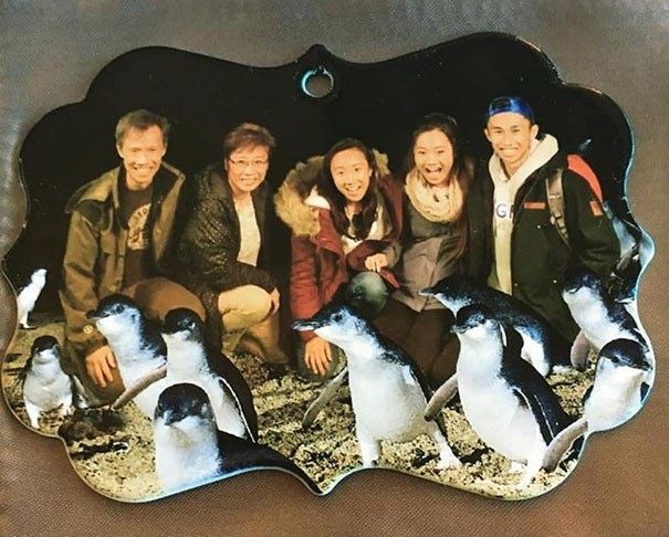 I just wanted a simple keychain, but I received this one depicting an Asian family complete with photoshopped penguins!