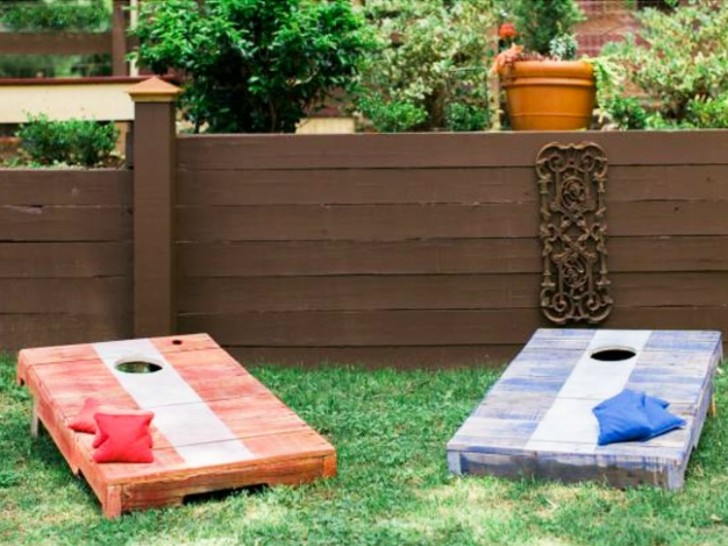 7. Wooden pallet platforms for a cornhole or bean bag toss lawn game.