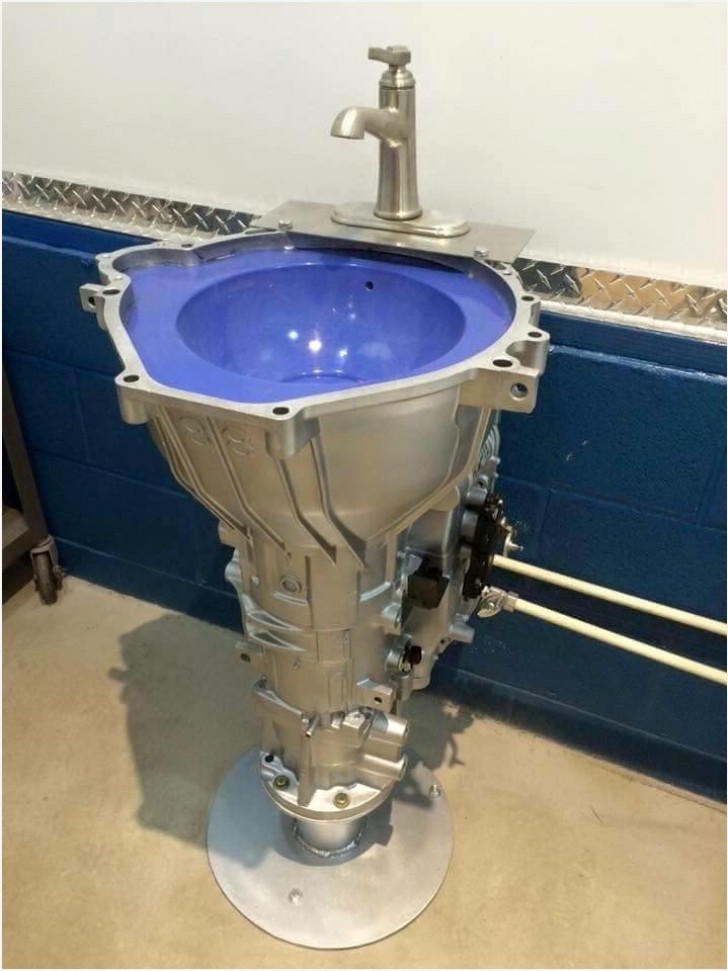 12. A bathroom sink made from a car transmission