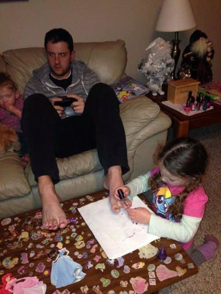 1. This is a Dad who lets his daughter experiment with her artistic talents while not neglecting his own!