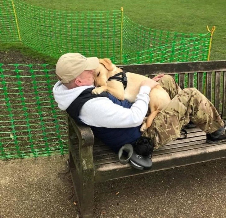 1. Just see how much tenderness there is in the embrace of this man as his puppy sleeps protected and cuddled in his arms.