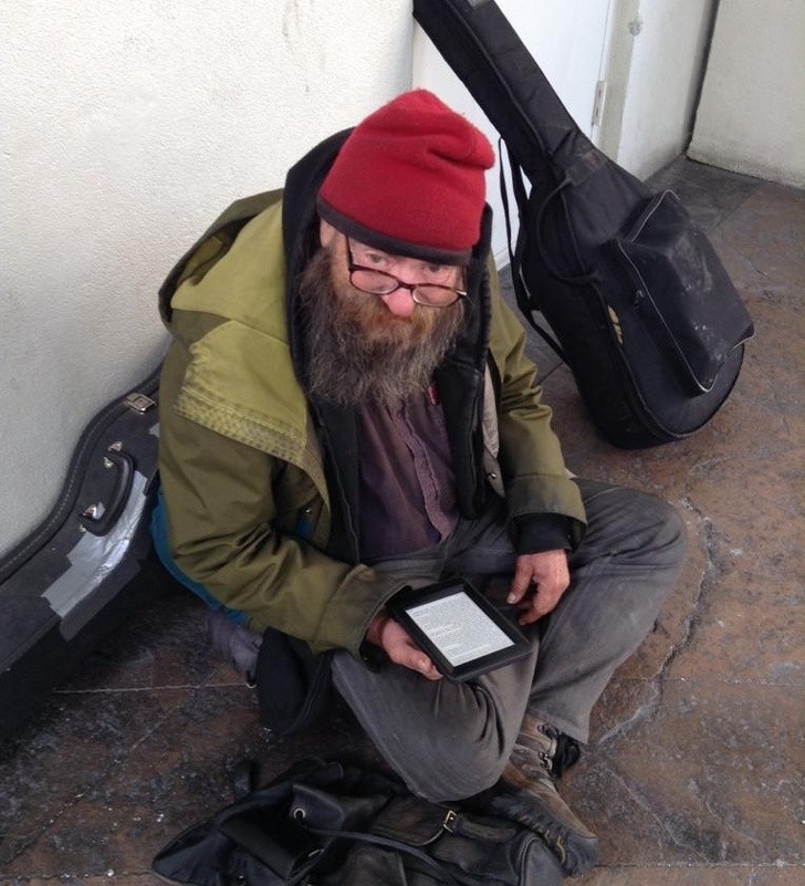 12. This homeless man has been reading the same book for as long as he can remember --- and now a passer-by gives him their Kindle reader which holds hundreds of books!