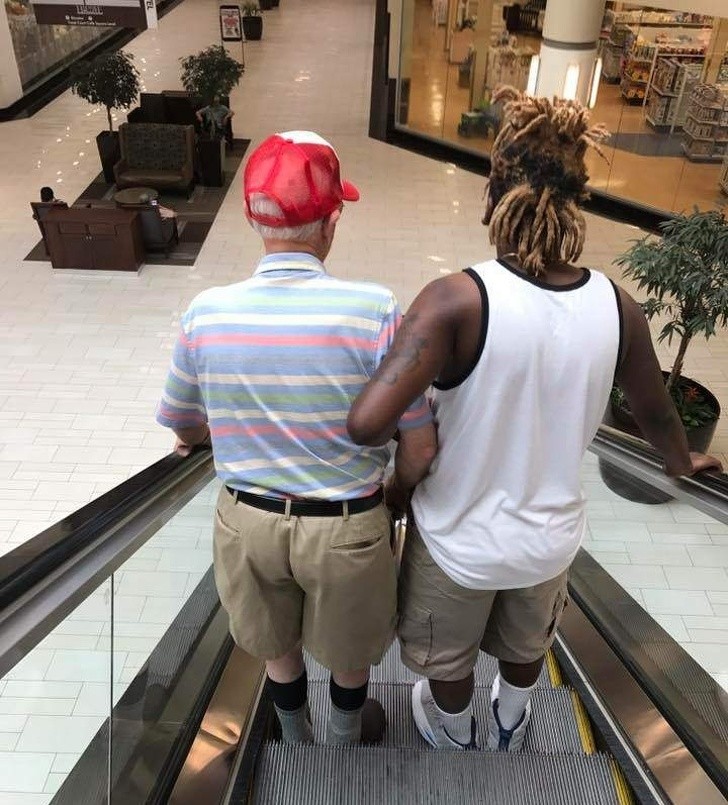 19. This elderly man was afraid to take the escalator and a young man volunteered to help him.