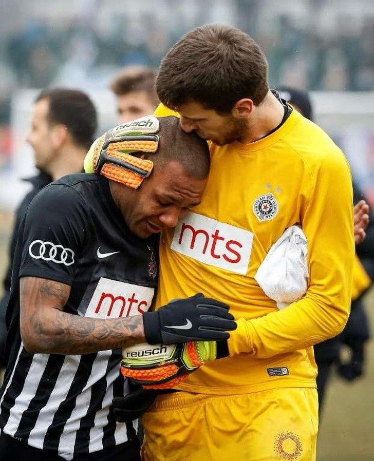 9. The goalkeeper of the Partizan Belgrade soccer team comforts his teammate who had been humiliated by racist insults throughout the game.