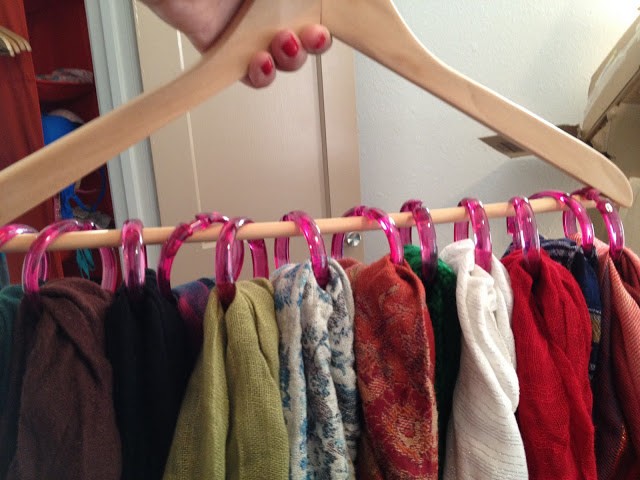  Keep scarves and shawls in order using hooks and a hanger.