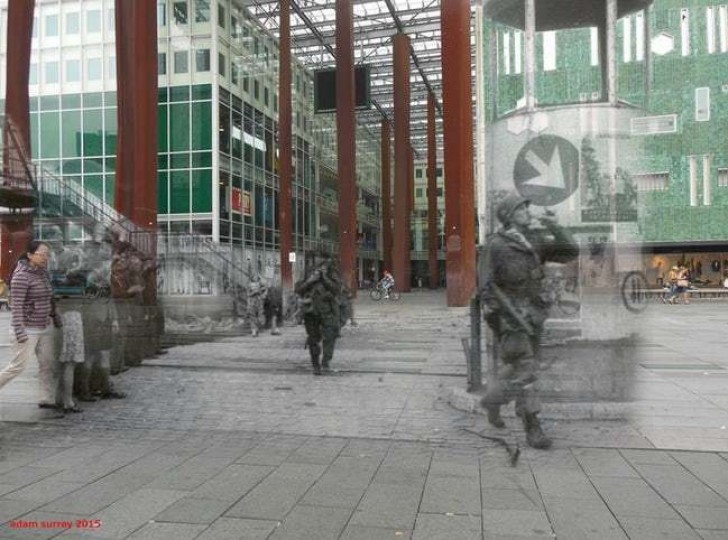 5. Soldaten des zweiten Weltkriegs und moderne Bürger treffen sich auf den Straßen von Eindhoven, Niederlande.