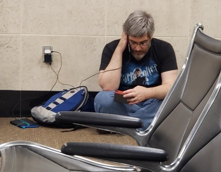 A dad far from home still reads fairy tales to his children as he waits at the airport. Parental love knows no boundaries!