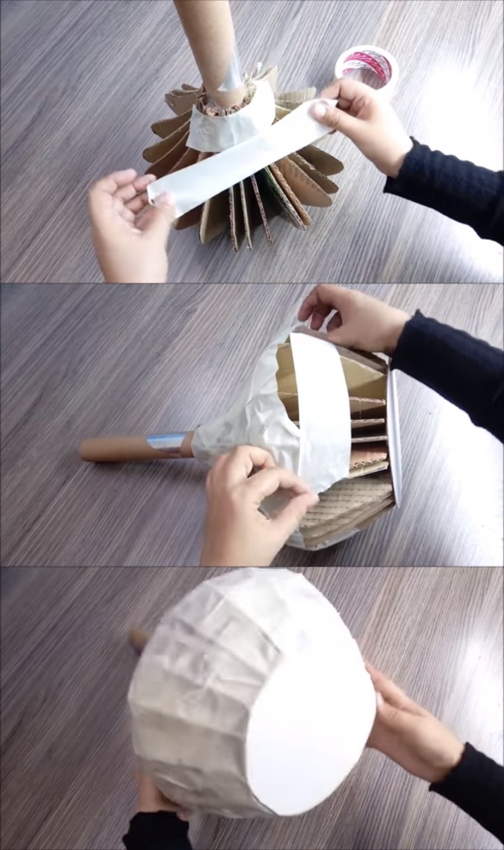 5. Cominciate a rivestire il lavoro incollando strisce di nastro adesivo di carta, finché non avrete coperto tutta la superficie del vaso