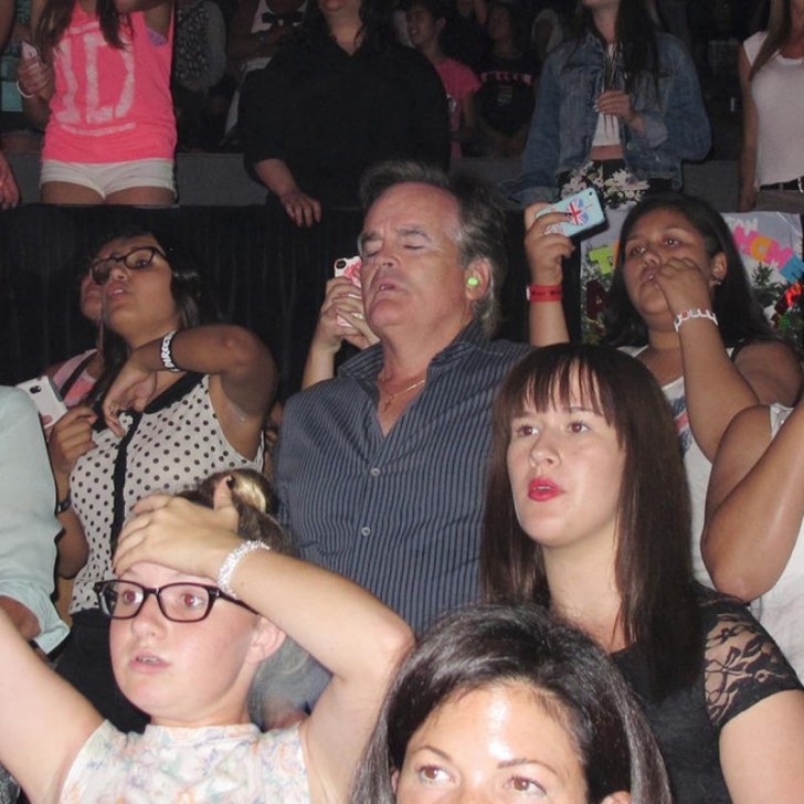 7. This dad would do anything for his daughter ... even accompany her to a One Direction concert!