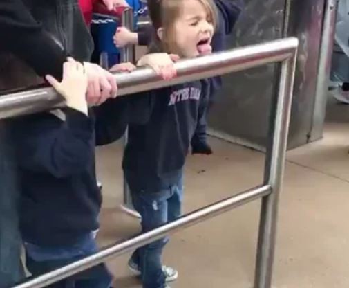 This little girl doesn't know what she's gotten herself into licking this side rail...