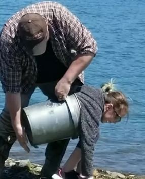 How she got stuck inside the bucket, we'll never know...