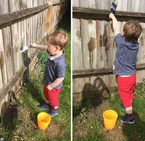 This little boy wanted to paint this fence so badly... luckily he was okay with painting it with water!