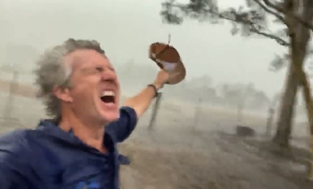 My father shouting for joy after it started raining; he owns a farm and there's been a drought for several months