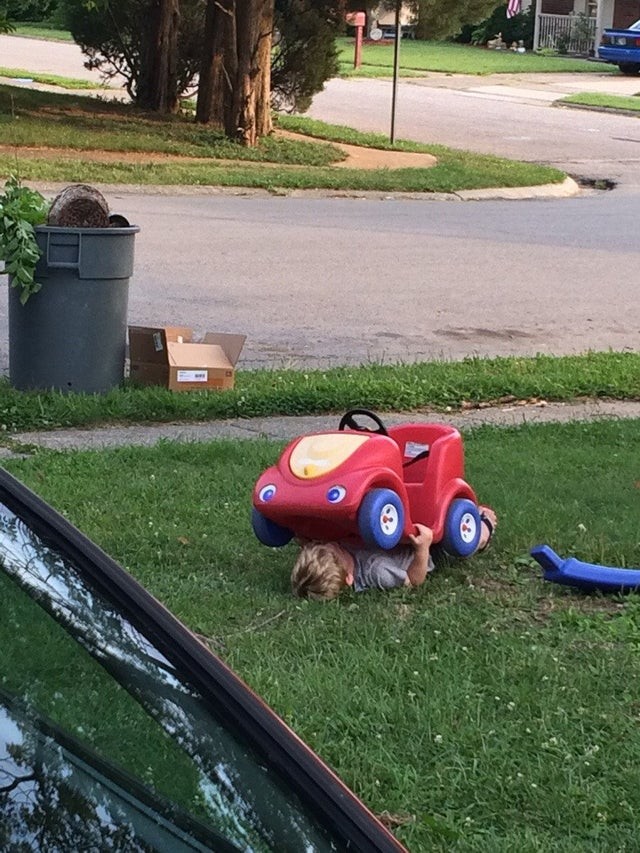 6. Yes, this is my son playing hide and seek and trying to disguise himself under his pedal car