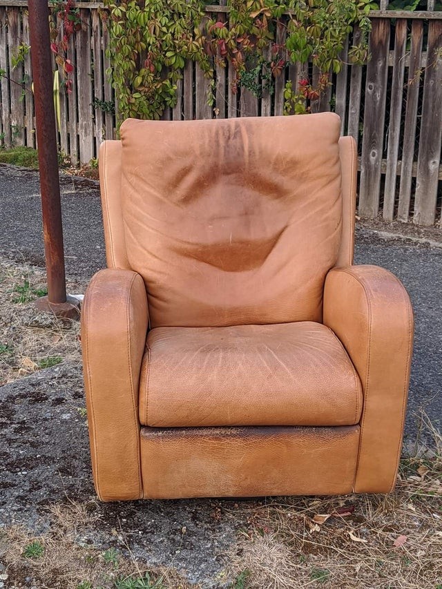 A happy old armchair after years and years of honorable service.