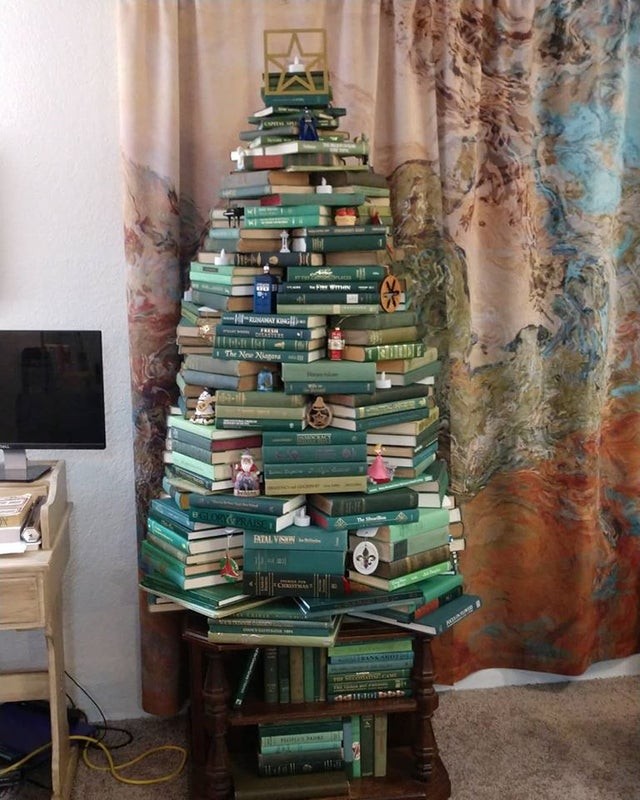 5. "This year, the green-covered books in our library formed the basis for the perfect literary Christmas tree!"