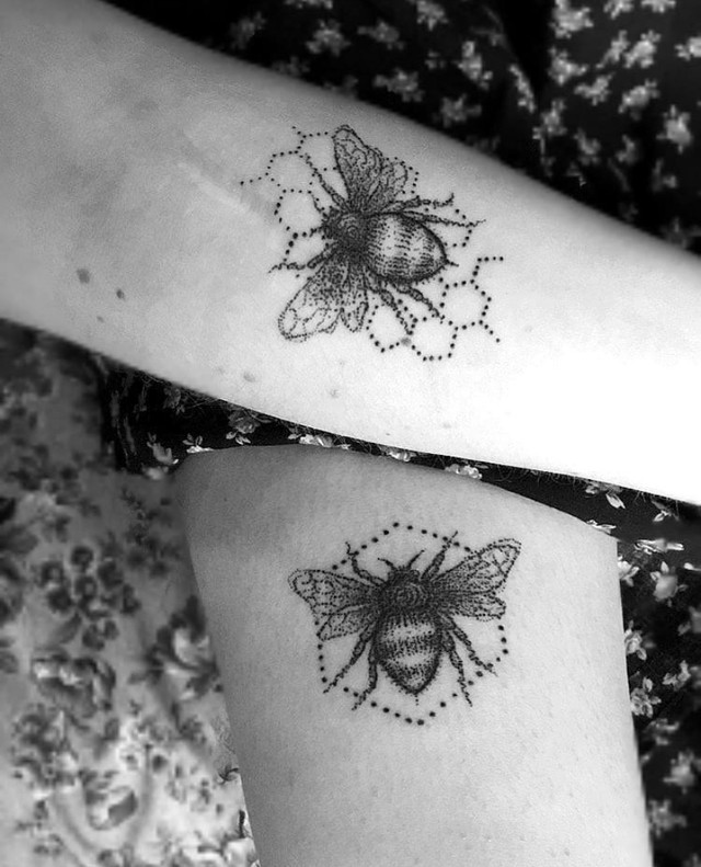 Love between sisters shown in a very fine and artistic tattoo