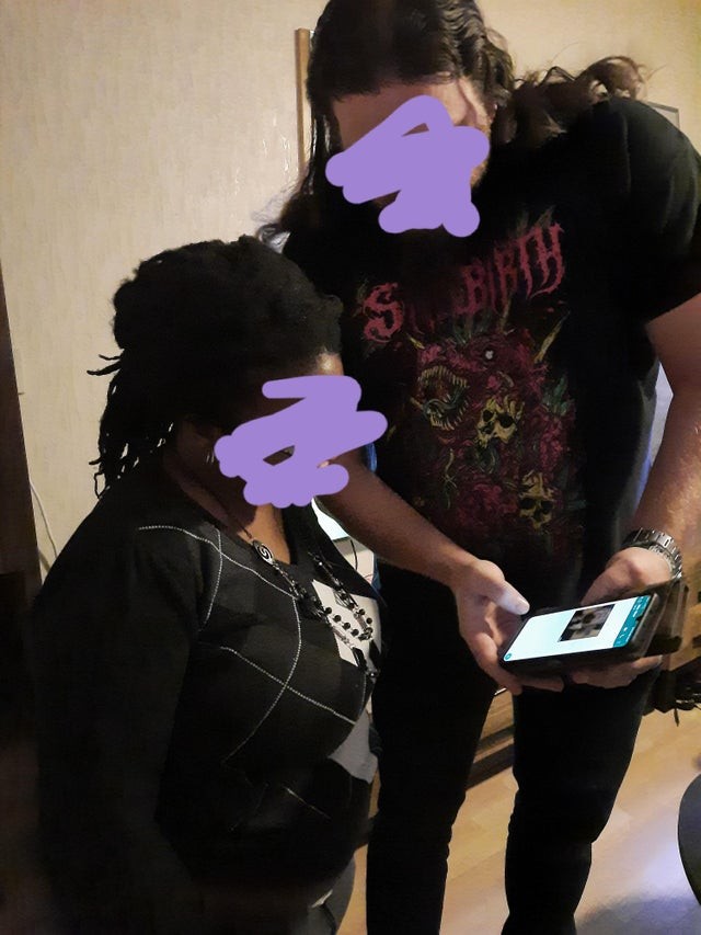 When a tall son has to show a cell phone photo to his short mom!