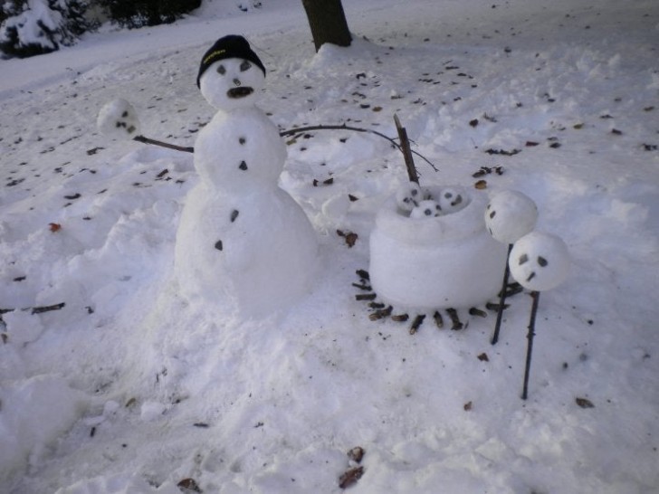 A snowman and his little family!