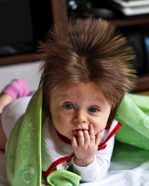 14. Did someone wake up sick this morning or did mom and dad make you angry? This baby's hair speaks volumes.