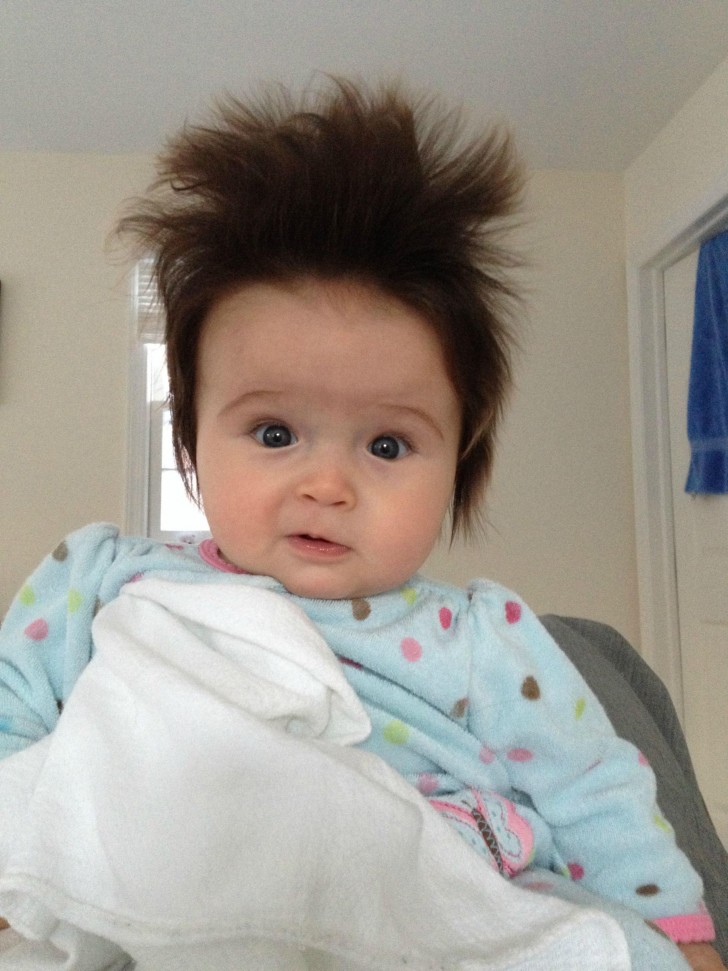 2. This puzzle-faced child has decided that today is the right day for a jaunty look.