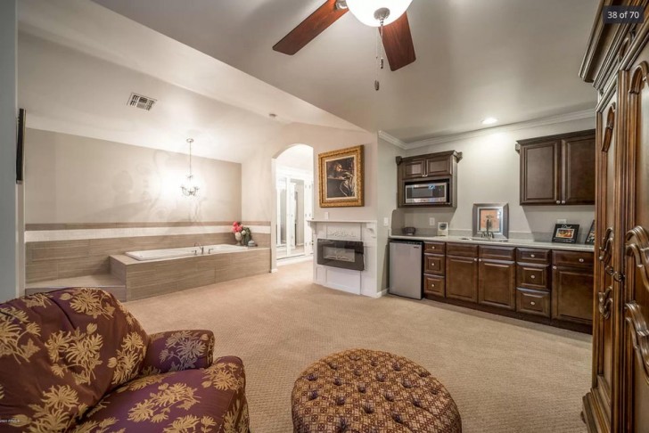 10. What is this room? A luxurious bathroom? A kitchen? ... is that a fireplace ?!
