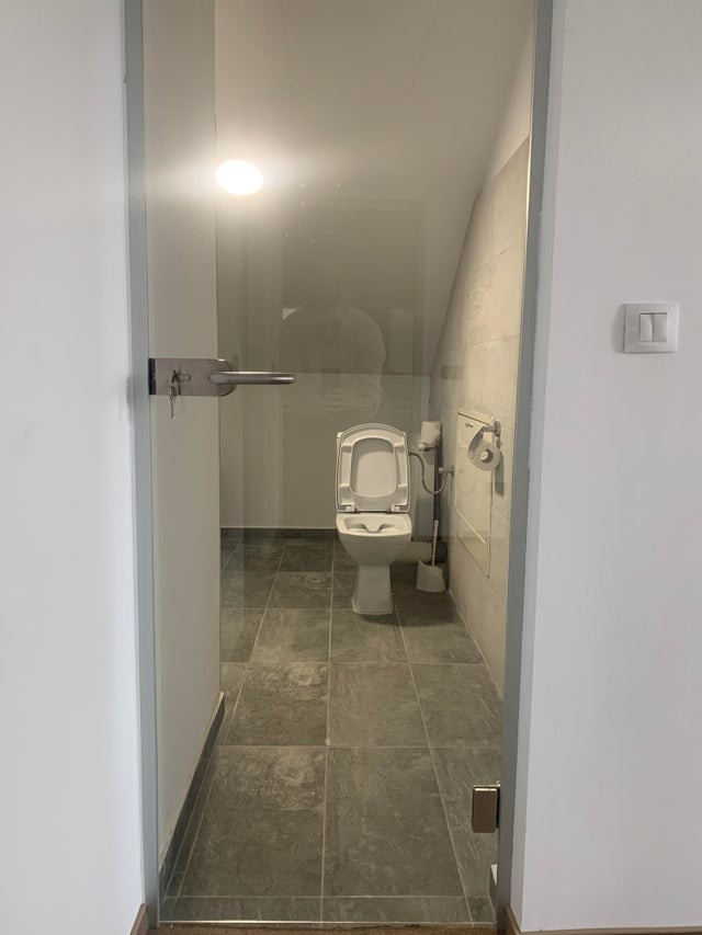 9. "This is the office bathroom door. It's transparent. No, it's not one of those expensive doors, where the glass becomes opaque when closed."