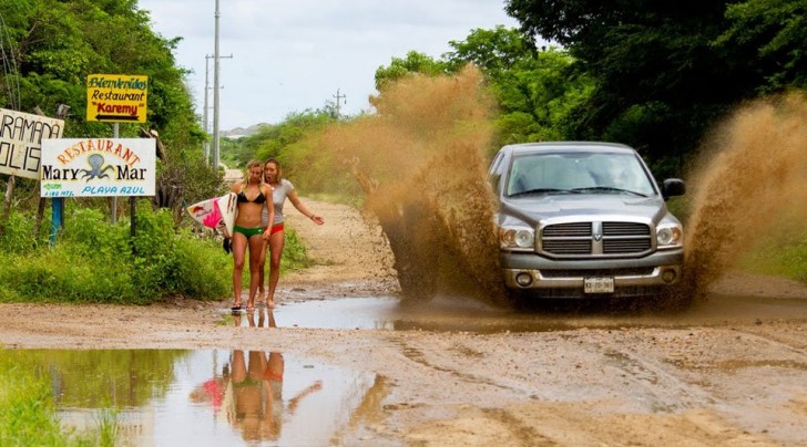 13. It is not a good idea to walk so near to puddles on the street when cars pass: not quite the soaking these girls had in mind.