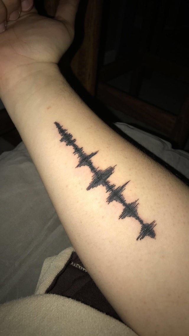 11. This boy decided to tattoo sound waves representing his father's laughter - a way to carry this joyful feeling everywhere.
