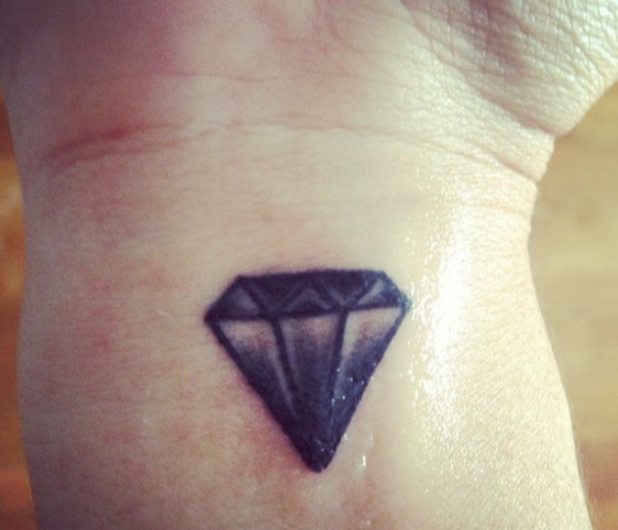 14. This woman has decided to cover an old tattoo with a diamond: hearts can be broken but diamonds cannot.