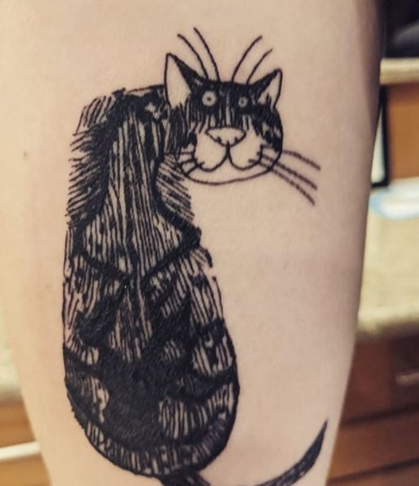 15. This tattoo reproduces the cat face drawn by a famous designer and the fur patterning from the guy's own kitten.