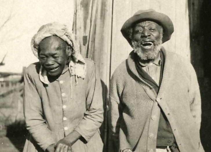 Husband and wife smile at home in 1914 Oklahoma
