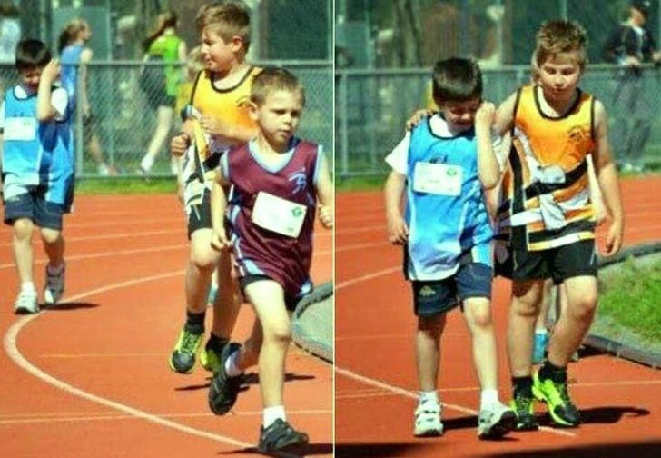 a child was in tears because he was finishing last in the race; the runner-up gives up his glory to comfort him!