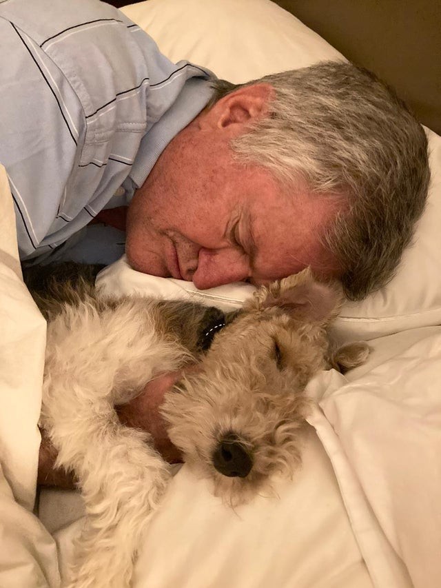 He didn't want dogs on the bed, on the sofas, on the furniture. Now she always sleeps next to him!