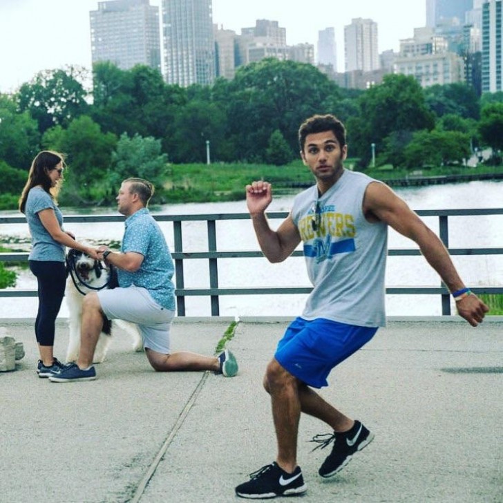 The moment this jogger notices he's invading a very, very special photo shoot ... look what's happening in the background!