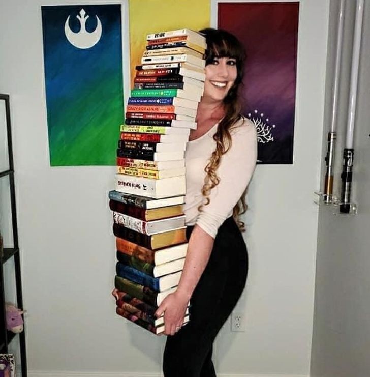 This proud woman showed off the towering column of books she managed to read throughout one year - well done!