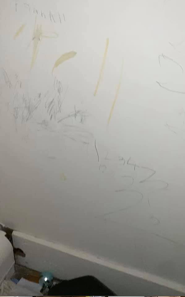 14. Writing and drawings on the walls.