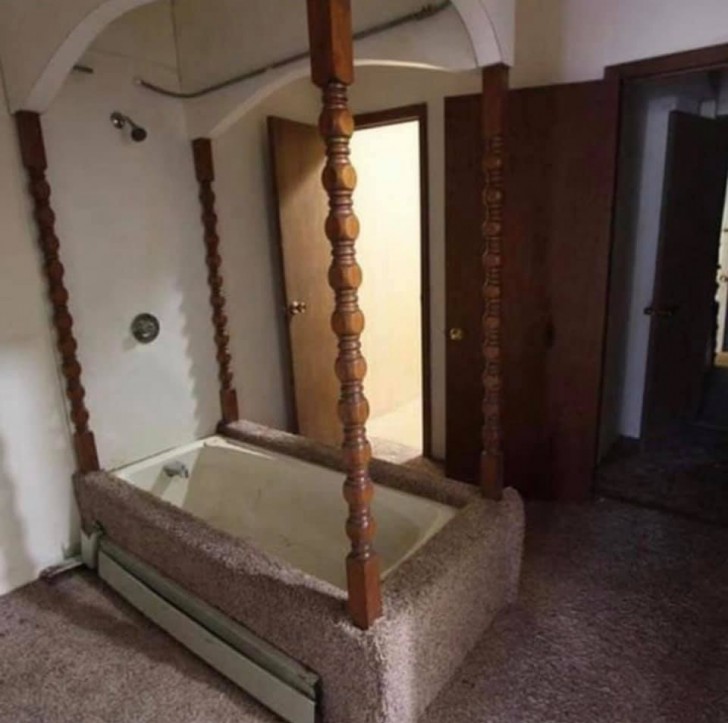 1. A four-poster bath tub surrounded by carpet?