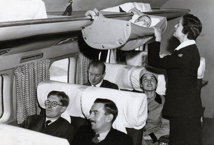 10. This is how we flew in the 1950s with a baby: hooked on to the overhead luggage rack!