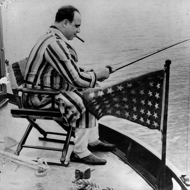 Al Capone, the fearsome crime boss, goes fishing aboard his yacht. This is 1931