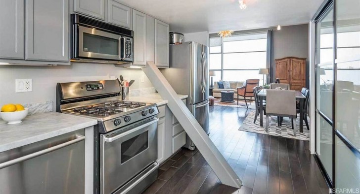 An apparently perfect and luxurious kitchen, ruined by a a bizarre beam ...