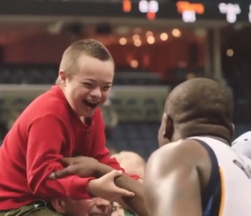 3. A child's joy in greeting his favorite basketball player