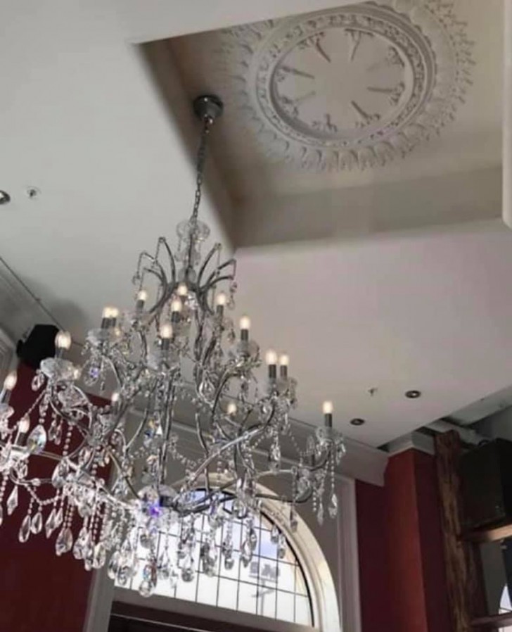 Can anyone explain to us how the heck they installed this chandelier?