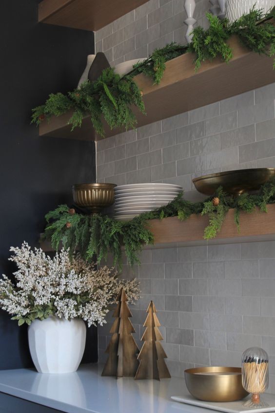 Branches placed on open-faced shelves in the kitchen