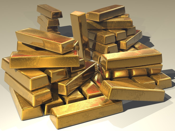 De mogelijke voordelen van het kopen van goudstaven of munten als belegging