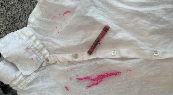 Remove fresh crayon stains from clothes