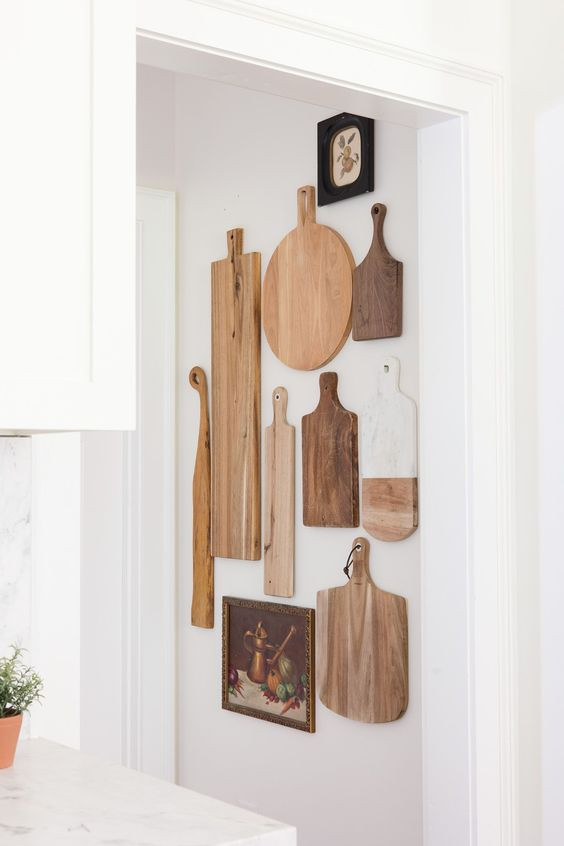 cutting board collection displayed on a wall