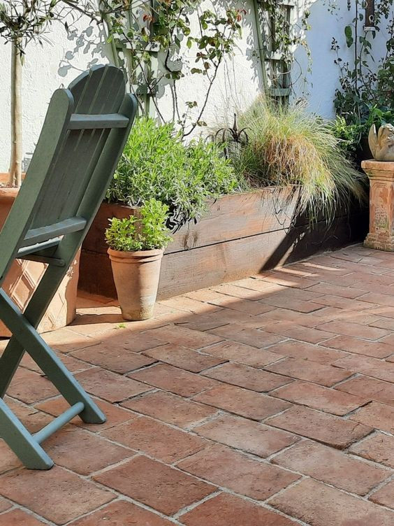 a section of outdoor, terracotta flooring